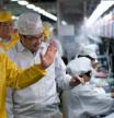 Apple CEO Tim Cook during his visit to a Foxconn factory in China in March 2012