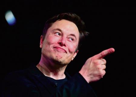 (FILES) In this file photo taken on March 14, 2019, Tesla CEO Elon Musk speaks during the unveiling of the new Tesla Model Y in Hawthorne, California. - Elon Musk's decision to pull Twitter off the stock market allows him to make major changes quickly, but it also takes the company more heavily into debt, a risky choice for a money-losing business. (Photo by Frederic J. BROWN / AFP)