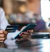 Woman making purchase with her credit card